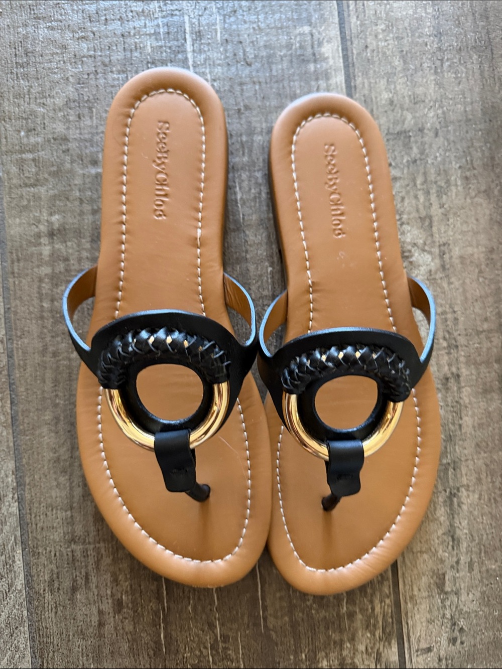 See By Chloe Black Leather Toe-Post Sandals with Gold Ring Accent